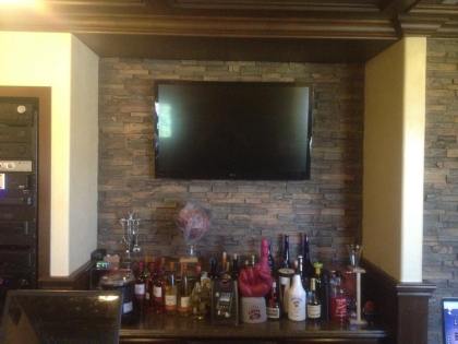 Elite Custom Audio Video installed a flat screen tv, lighting and a bar in this home in Orange County.